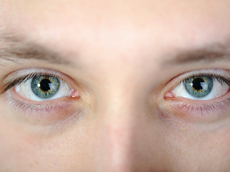 a close up of a person's eyes looking into the camera