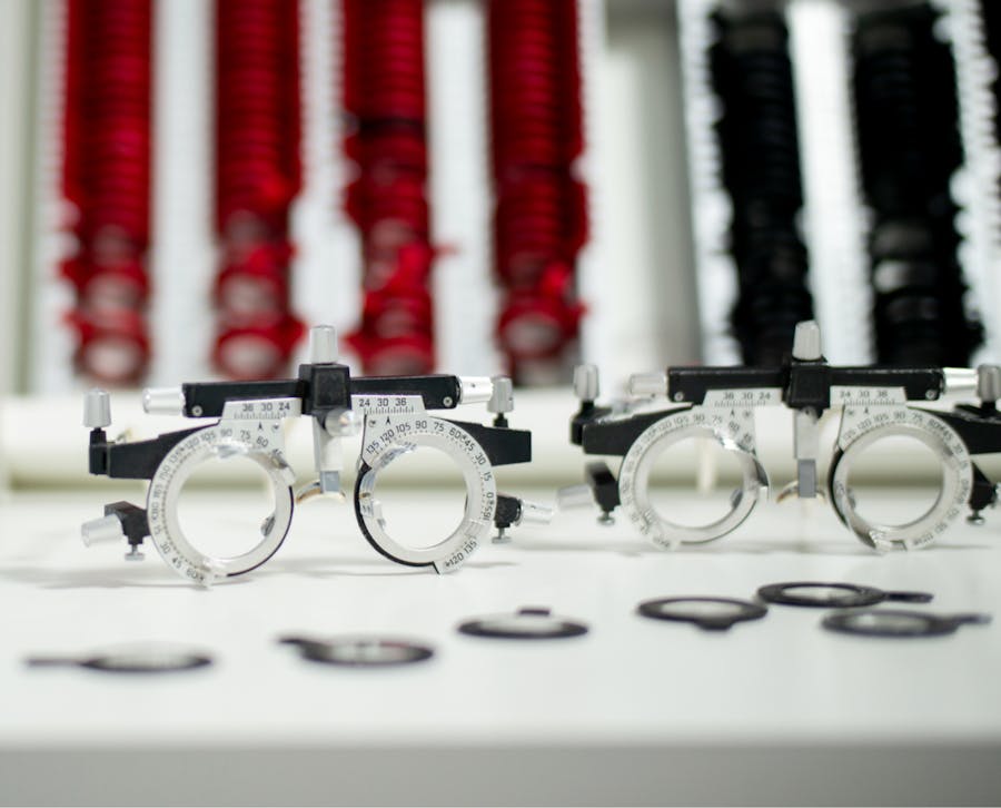 two glasses measurement devices that are sitting on a table