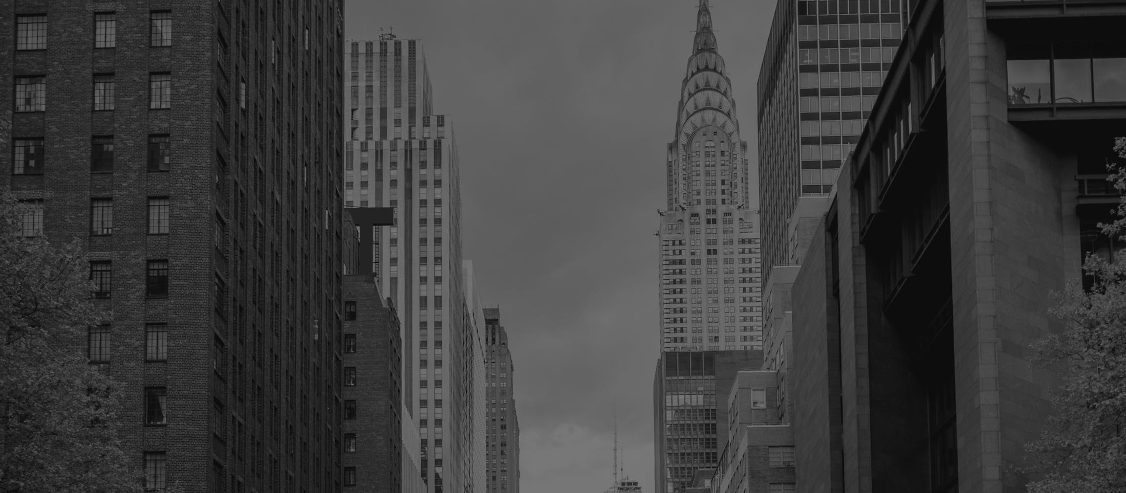 black and white photo of a city buildings