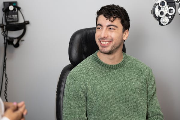 man smiling in patient chair