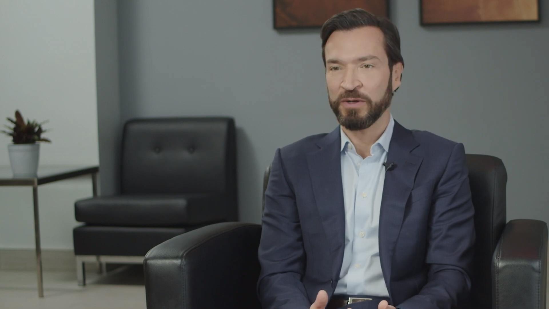 Dr. James Kelly with Kelly Vision sitting in a chair talking