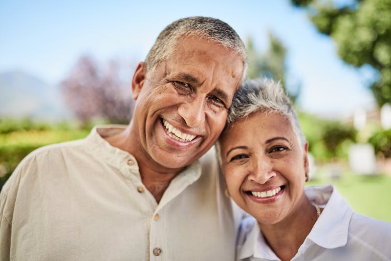Elderly man and woman smiling