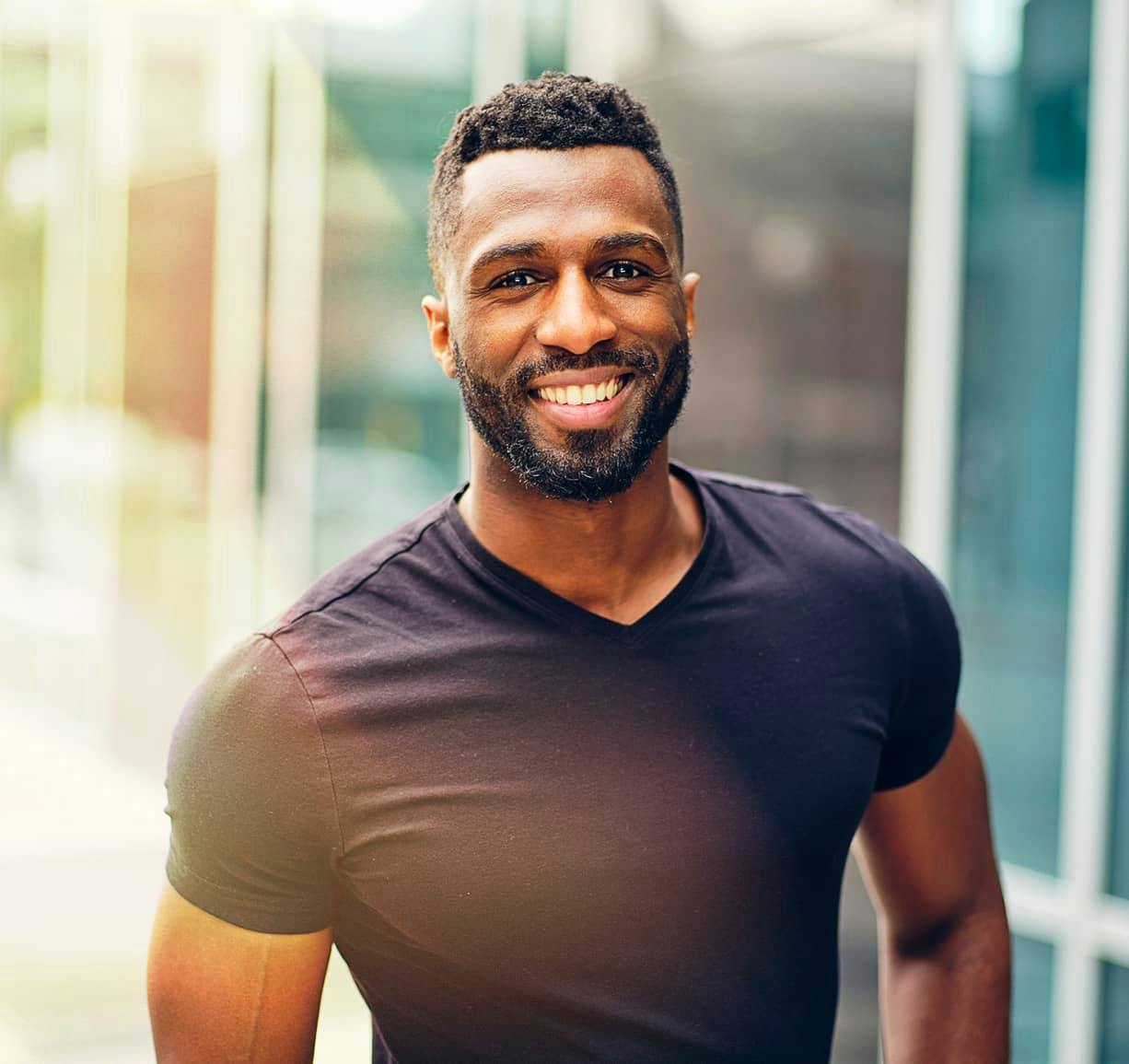 man looking straight into camera smiling