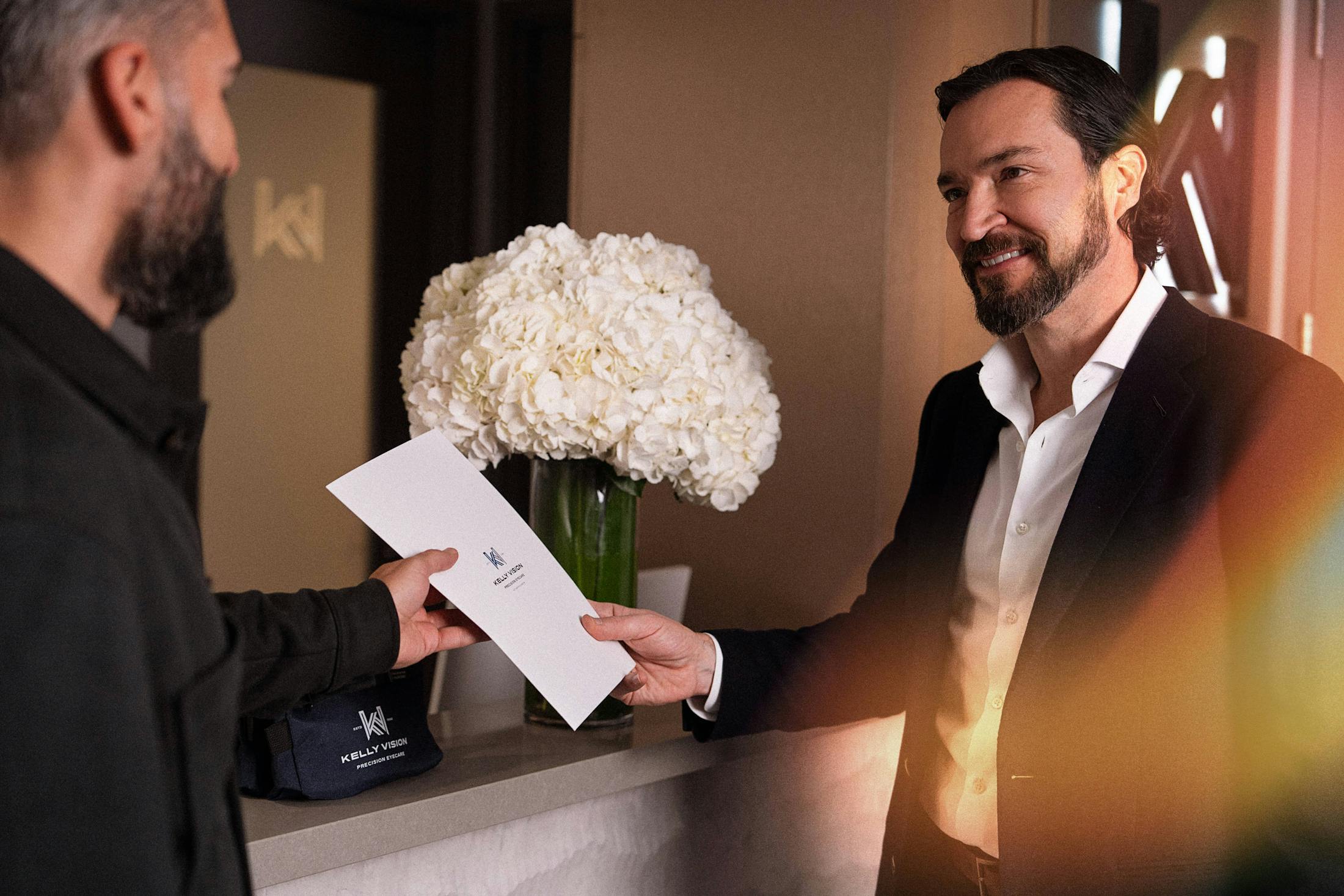 doctor with a patient holding a pamphlet of information