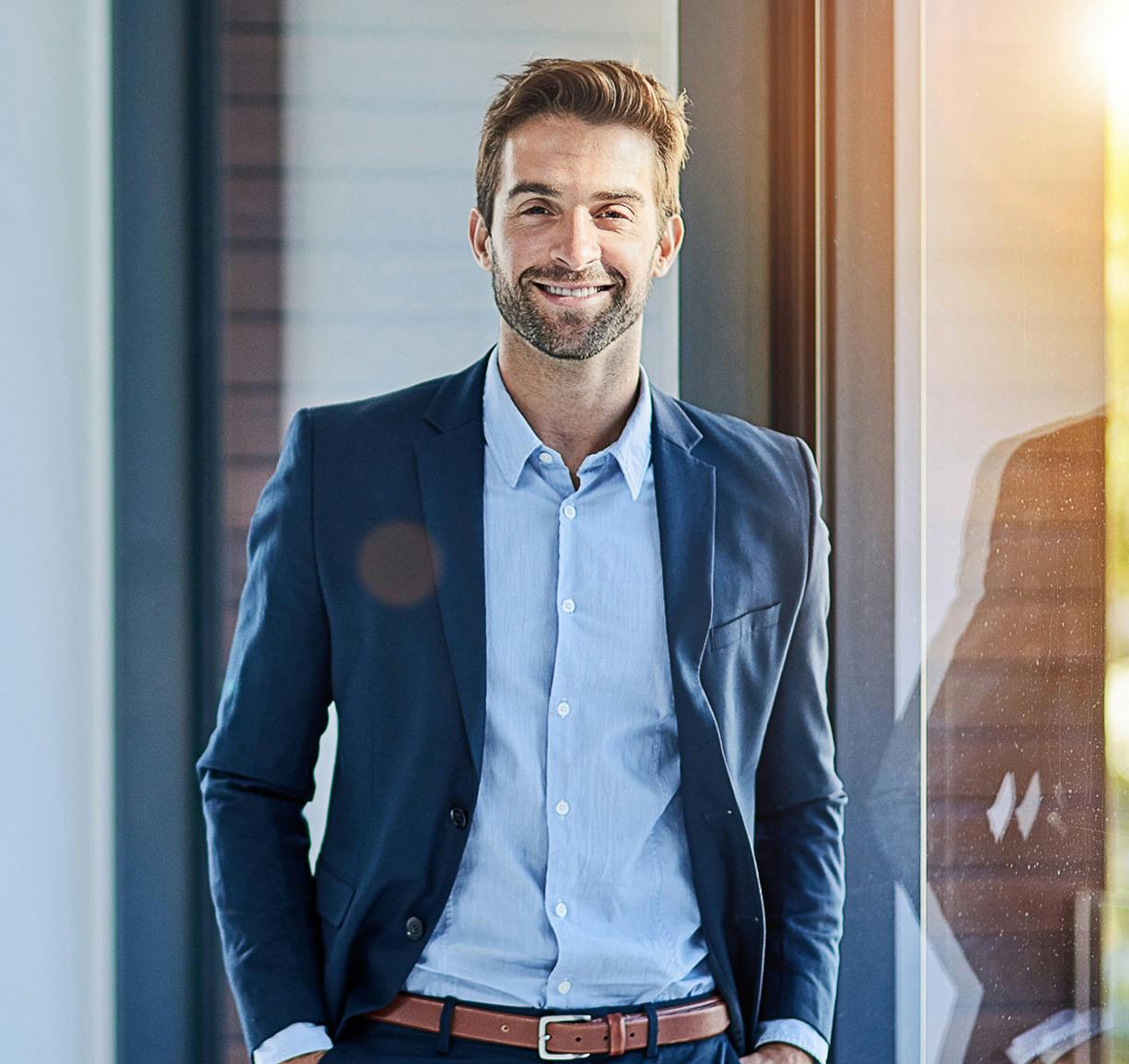 man with his hands in his pocket and looking straight ahead