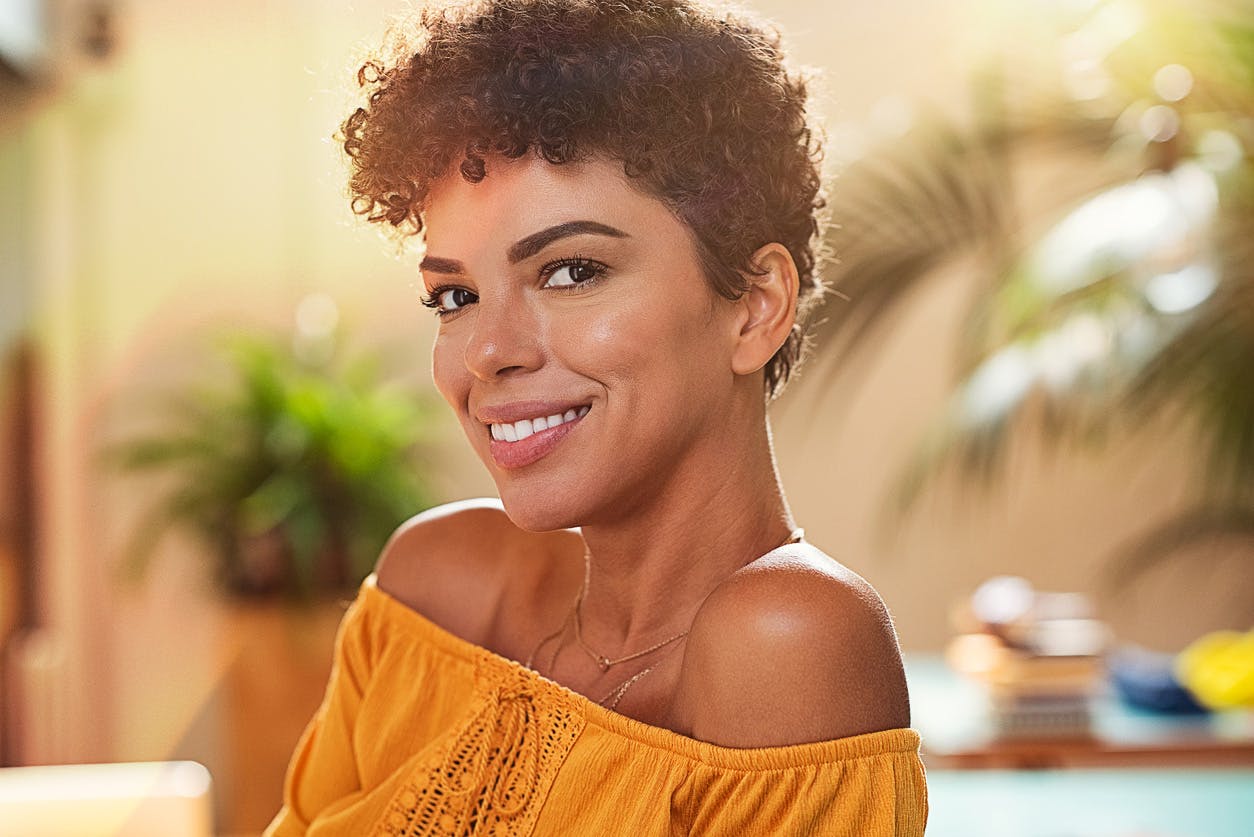 Middle aged black lady smiling