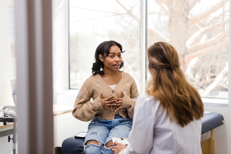Woman speaking with doctor