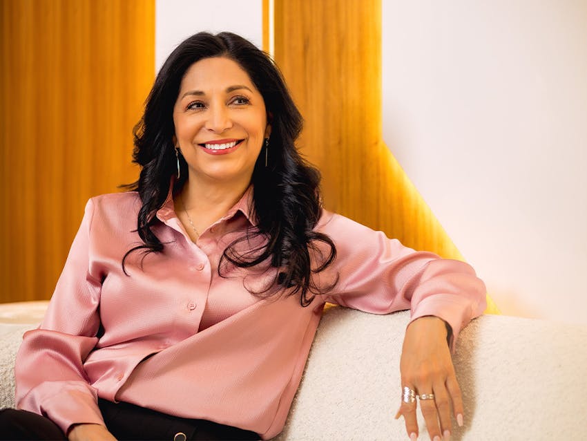 patient sitting on couch smiling