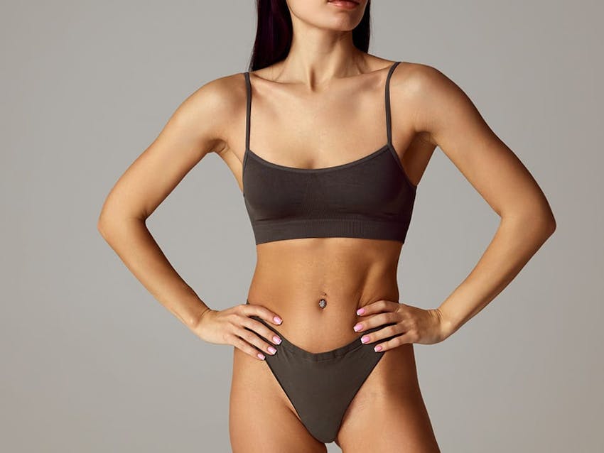 fit woman with hands on her hips