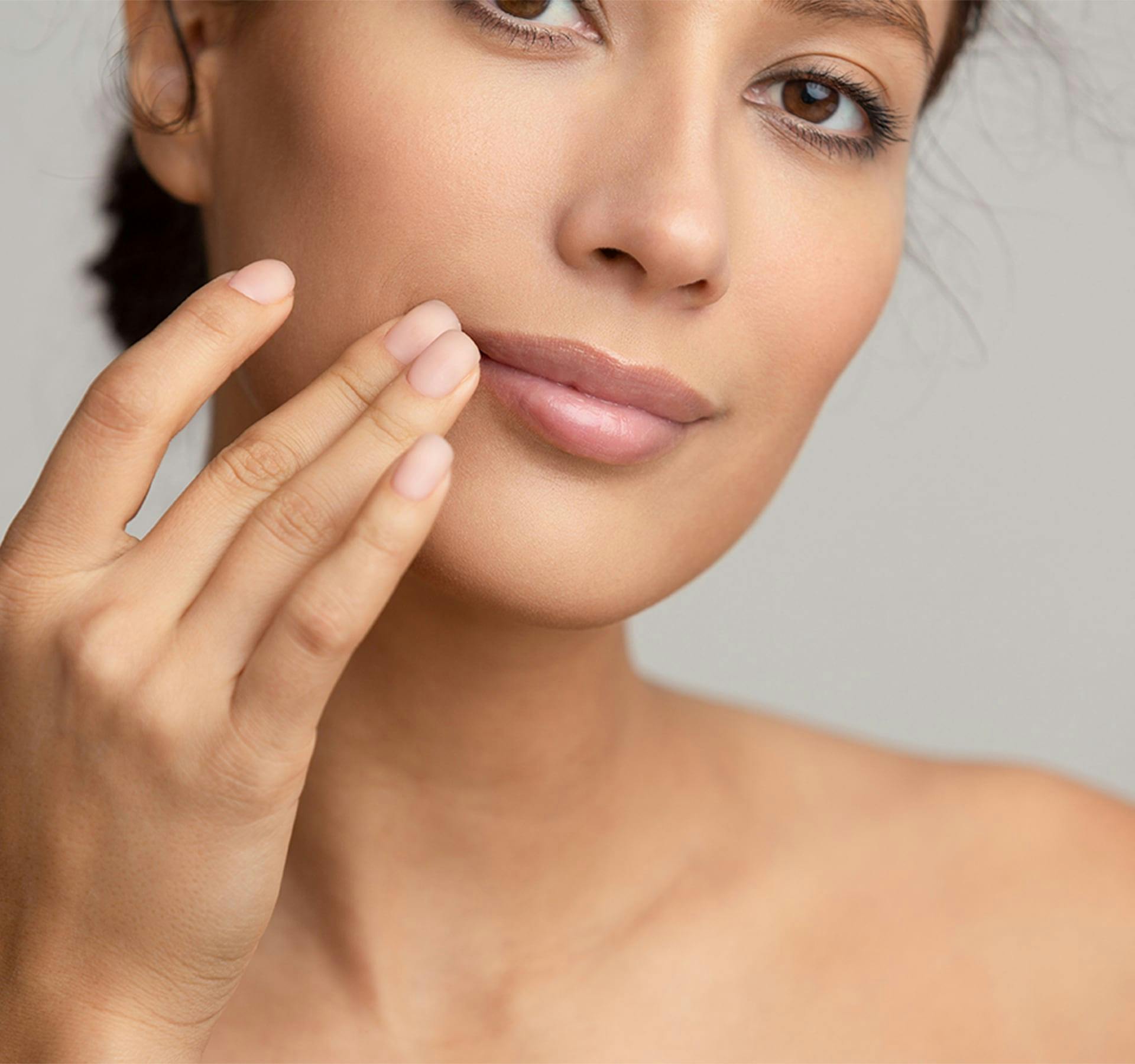 woman touching her lips