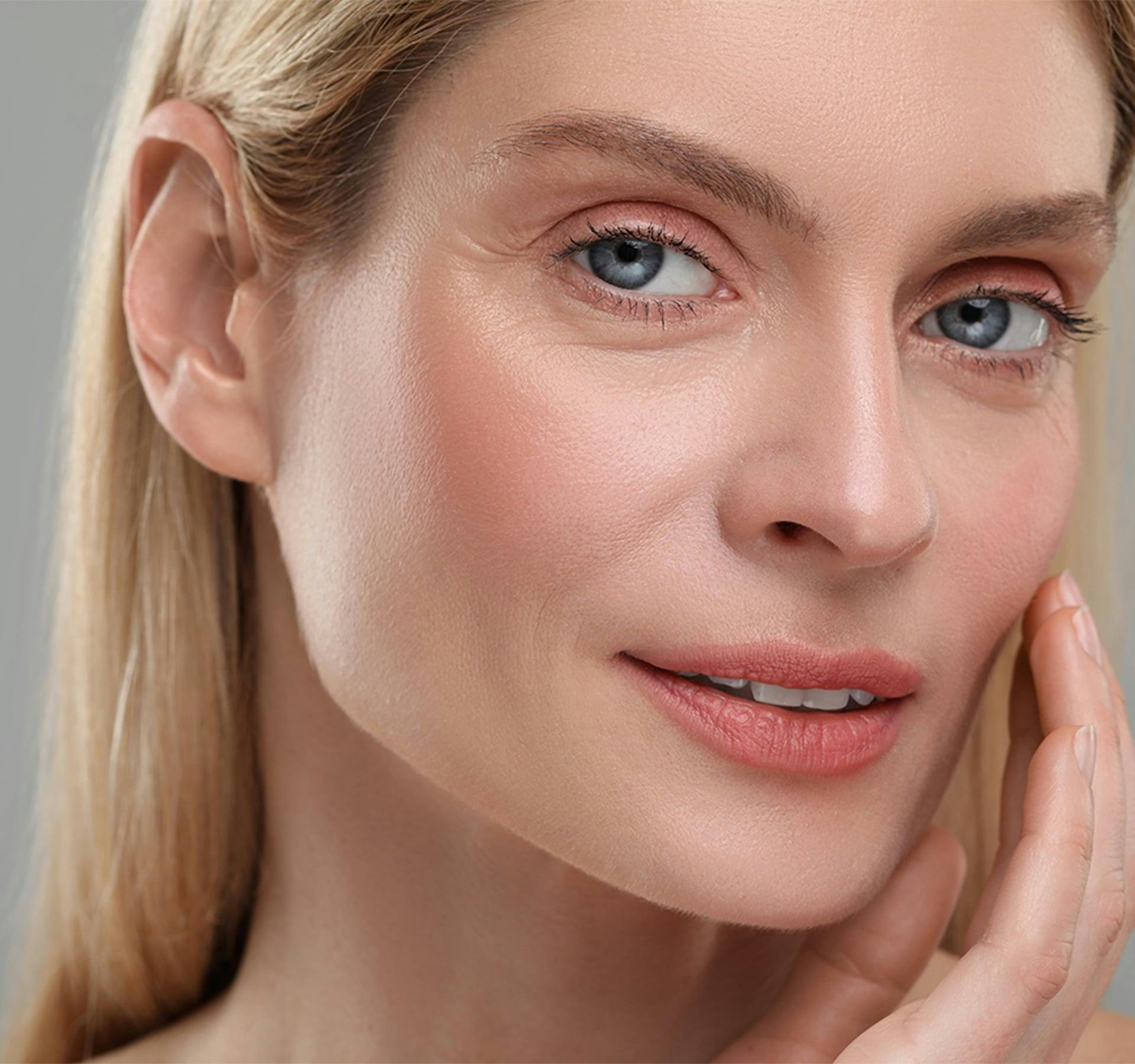 woman touching her face