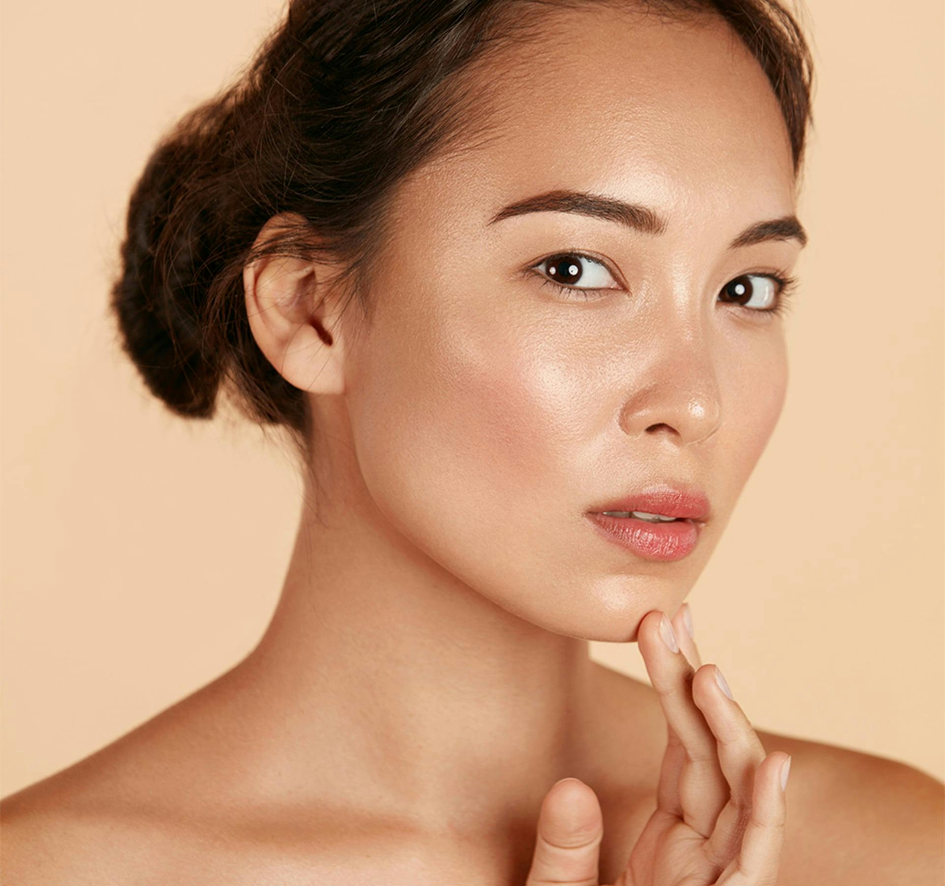 woman touching her chin