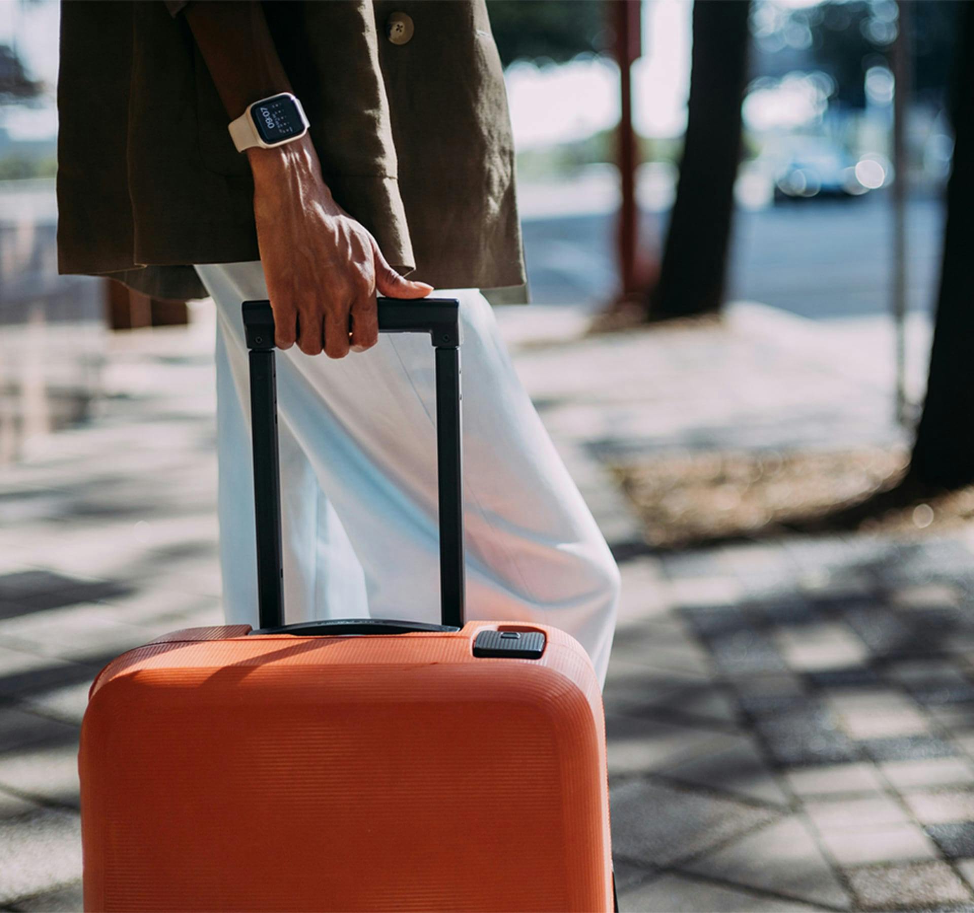 woman with hand on her luggage