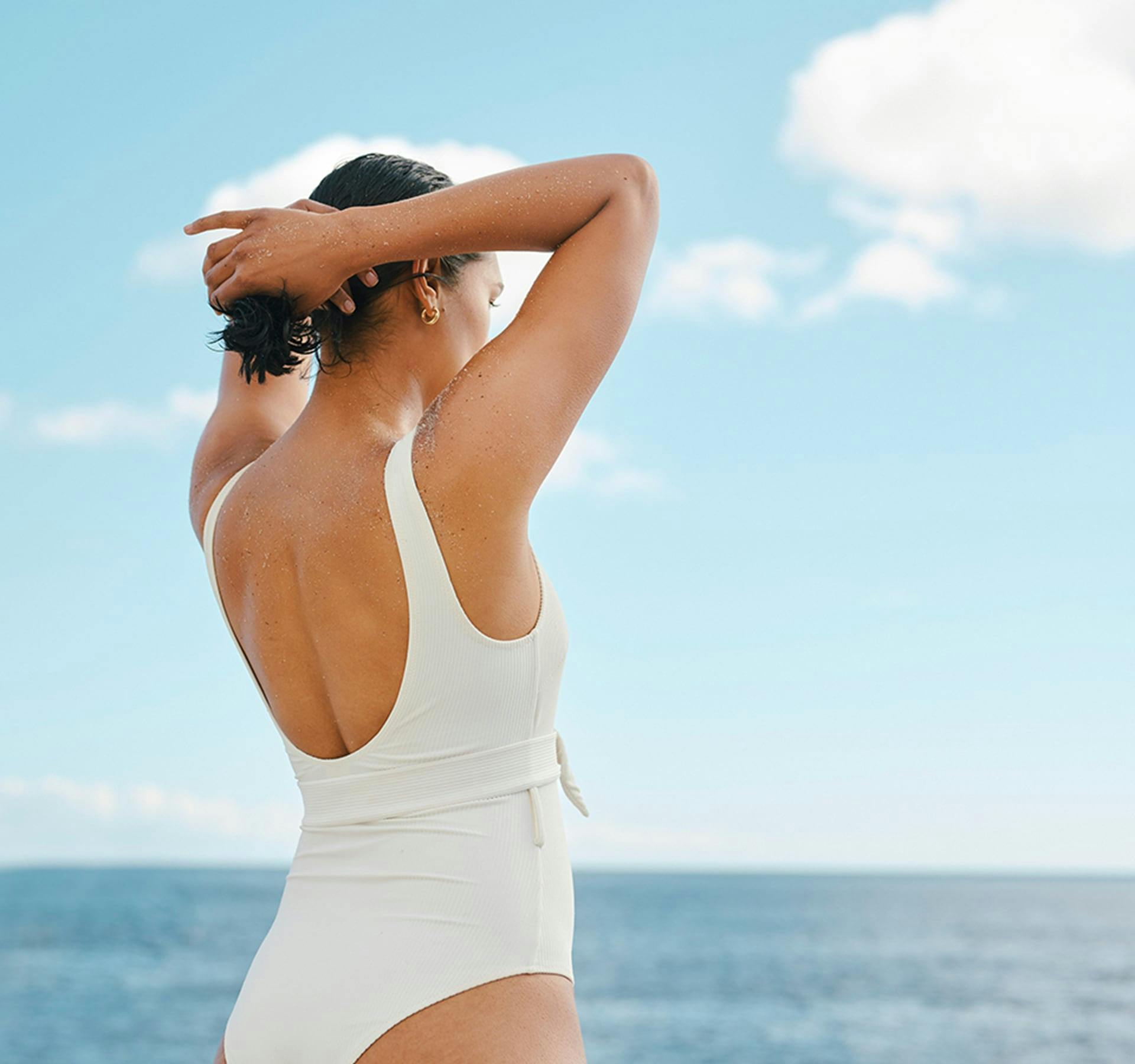 woman's backside as she looks at the water