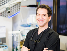 smiling man in scrubs