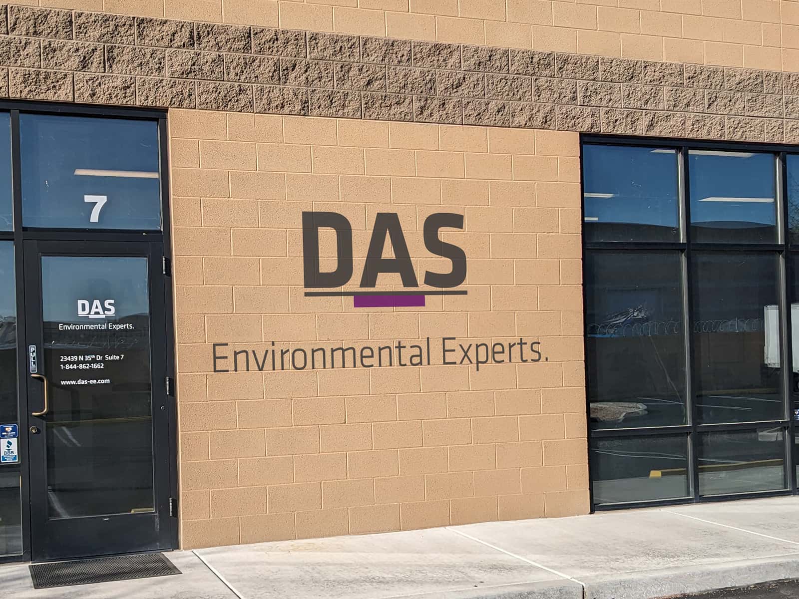 Front wall of an office with the DAS company logo on the wall