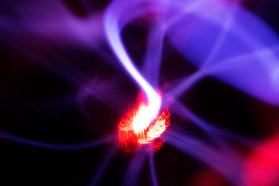 Plasma A vivid display of swirling neon blue and purple electric arcs emanates from the central glowing core within a plasma globe.