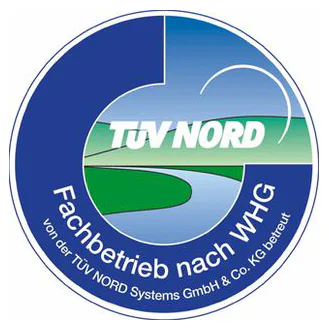 TÜV Nord Fachbetrieb nach WHG Seal The image shows a round, blue TÜV NORD logo with a stylised river in a green landscape and the text ‘Fachbetrieb nach WHG’ (specialist company according to WHG) in German.