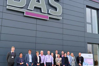 SEMI Committee Meeting A group of people in front of the DAS headquarter building.