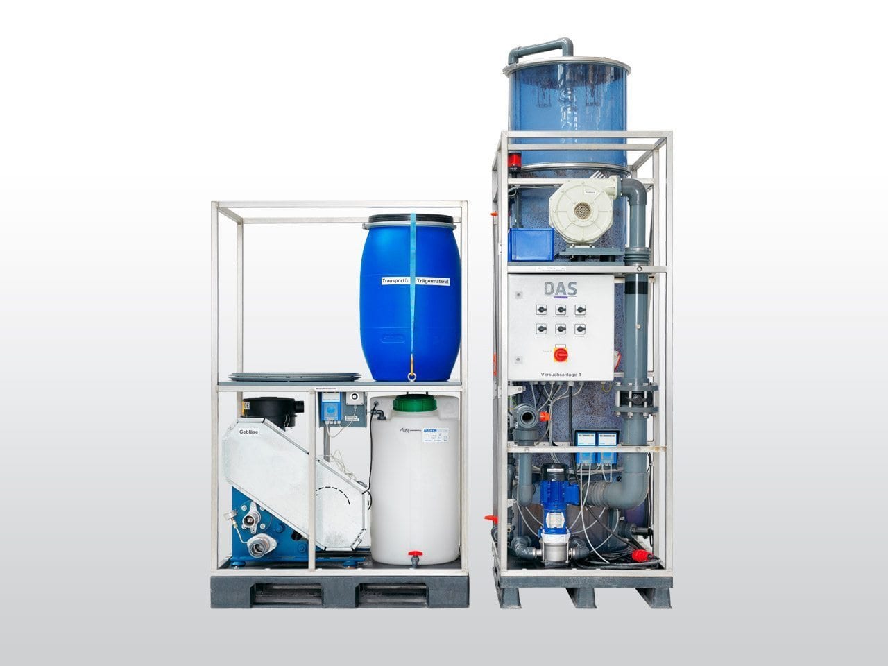 Two industrial water filtration systems with blue and white tanks connected by pipes.
