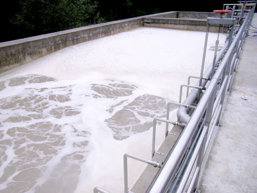 Reference Paper Industry Aerial view of a wastewater treatment facility with rectangular sediment tanks and pipes