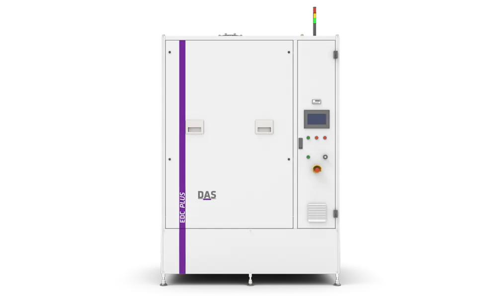 EDC PLUS by DAS EE The image shows a white industrial machine with control buttons and a digital display, labeled "DAS", set against a vibrant purple background, representing the advanced technology of the EDC PLUS by DAS EE.