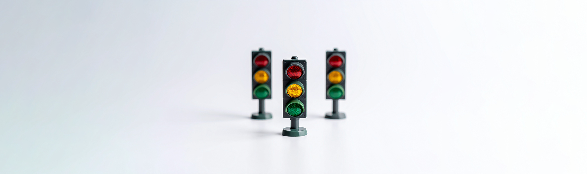 Set of three toy traffic lights, incidcating a process someone should take to implement SD-WAN