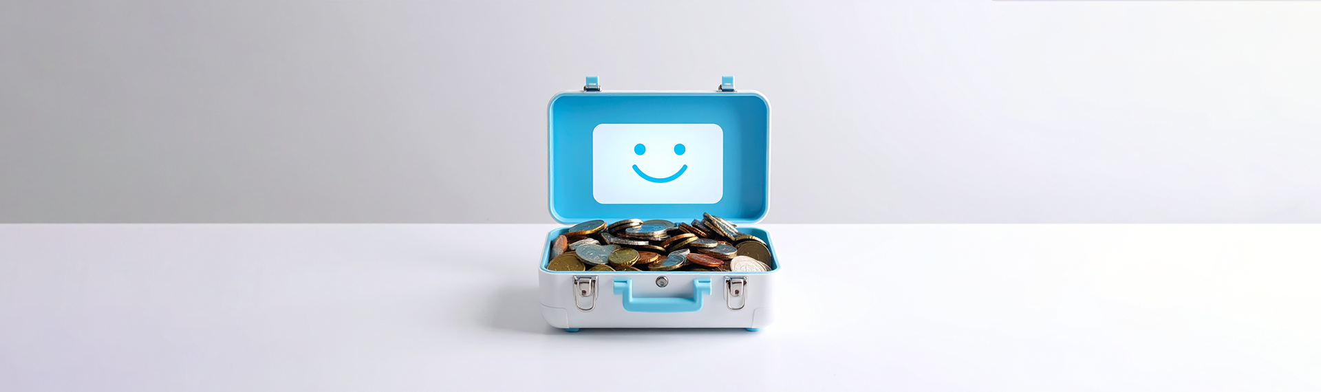An image of a toy briefcase with coins inside, showing the blog is about the financial services industry
