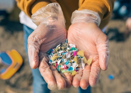 Hands holding plastic