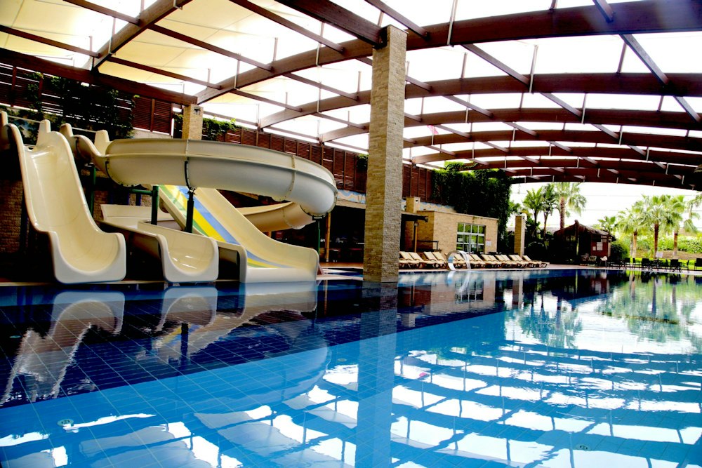 Covered pool with water slides at Adenya Hotel & Resort