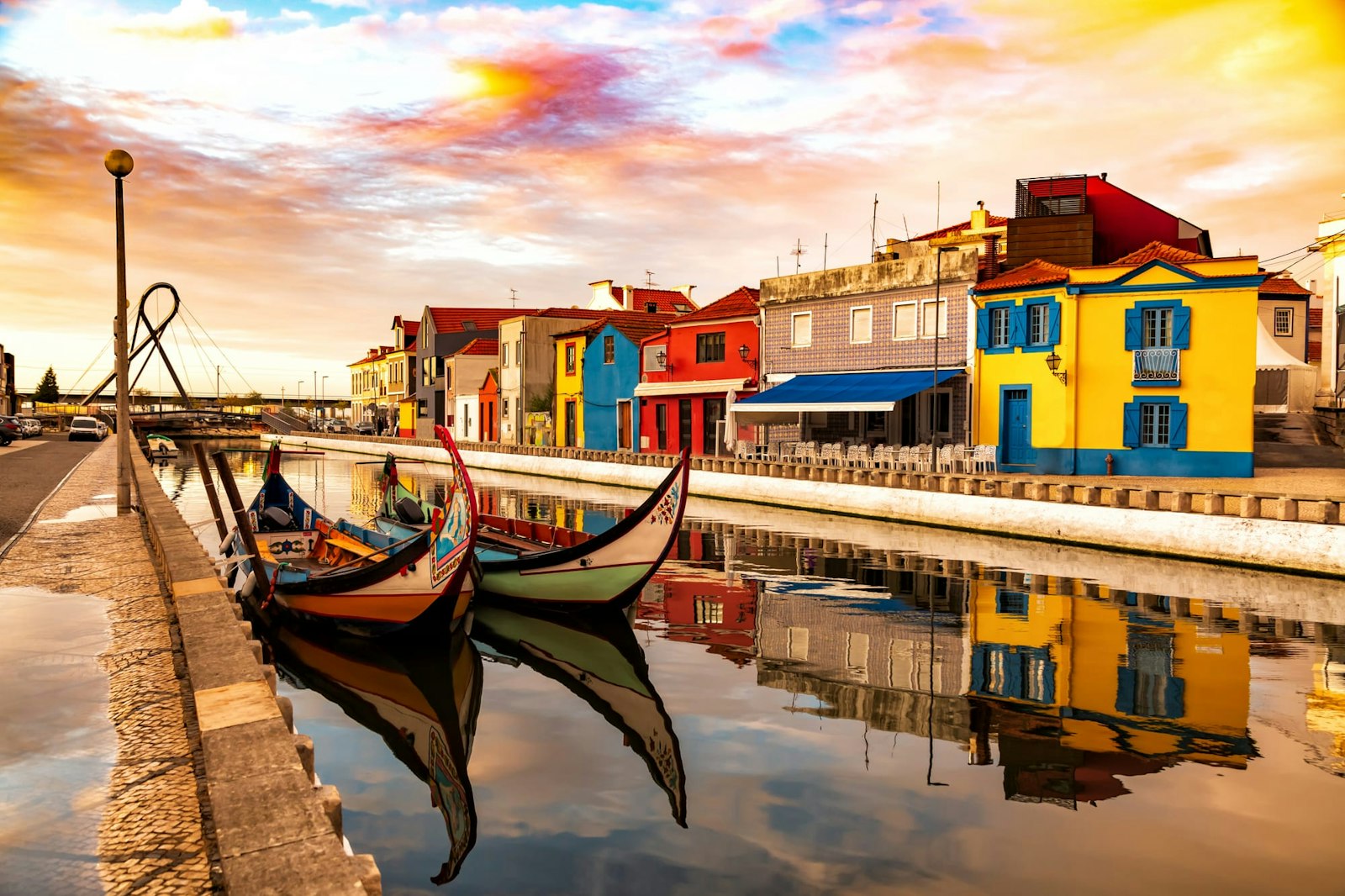 Traditional colorful Moliceiro boats docked in the water canal