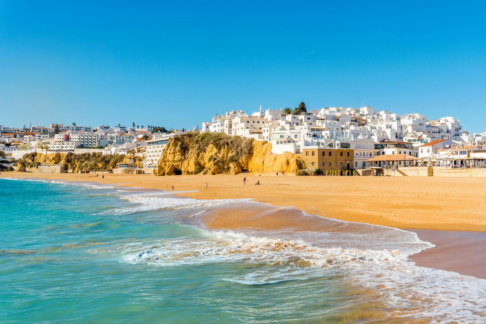 View from the beach on the white-washed city of Albufeira