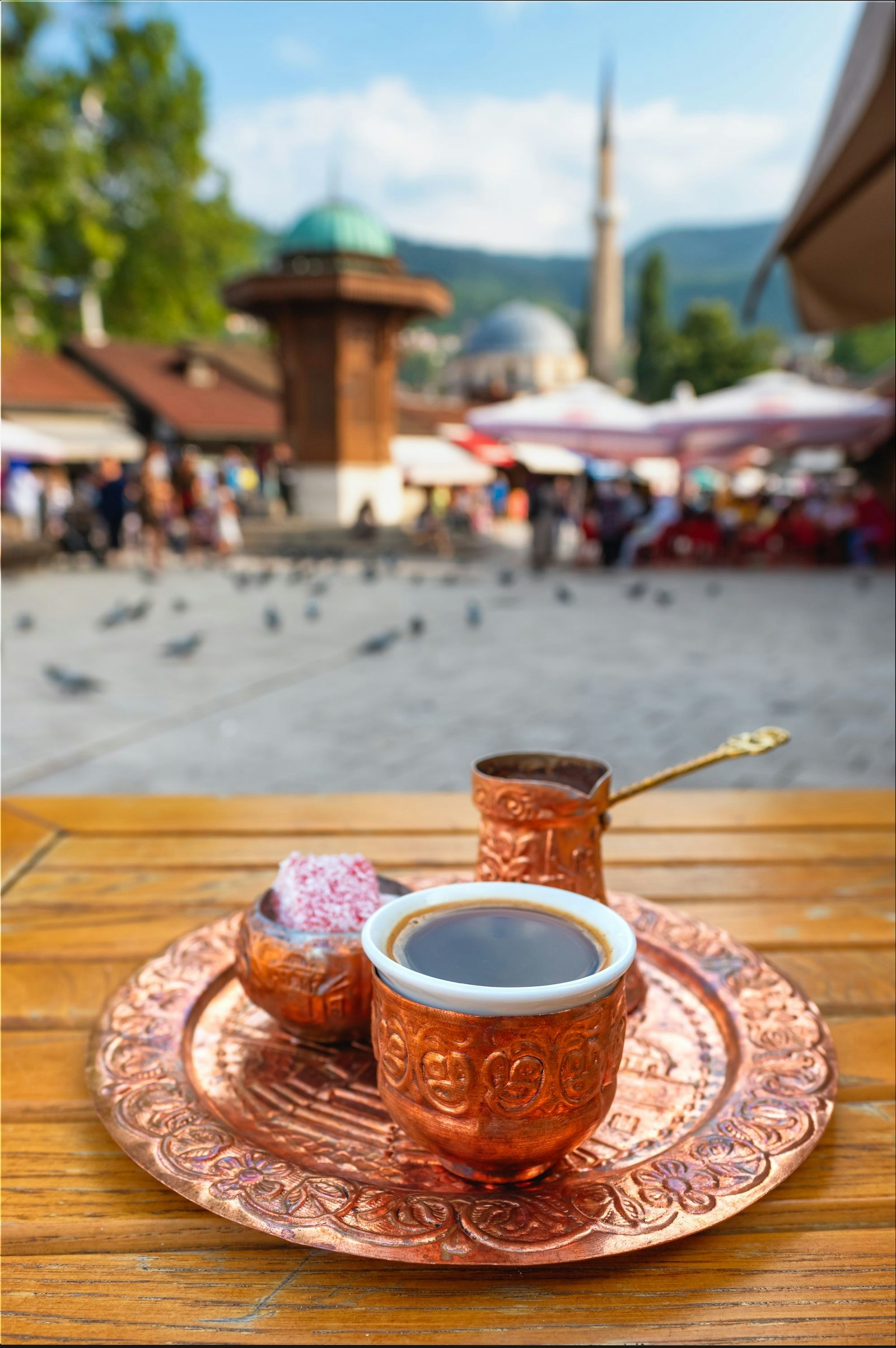 Traditional Bosanska Kahva on Bascarsija Square with the famous Sebilj Fountain in the background