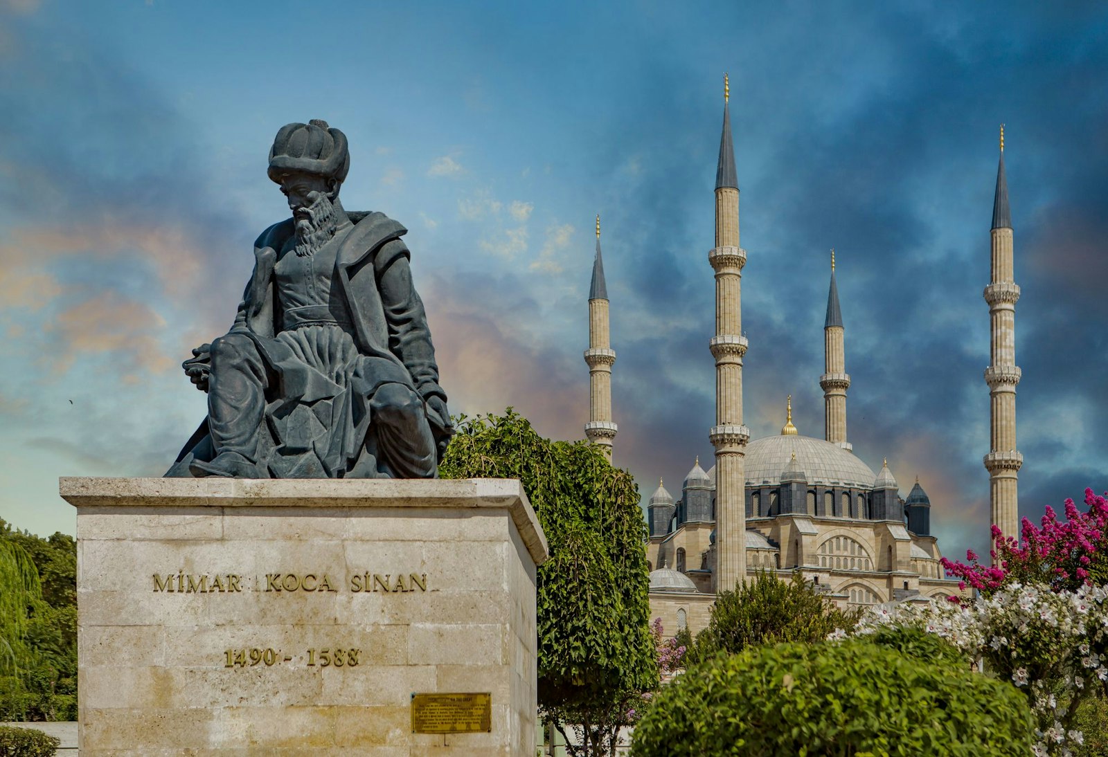 Statue of Ottoman master architect Sinan and "his masterpiece", the Selimiye Mosque, in the background, Edirne