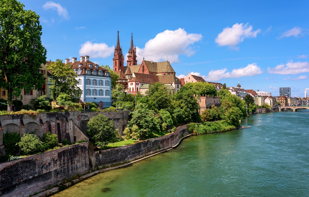 View of Old Town of Basel with red stone Munster cathedral and the Rhine river