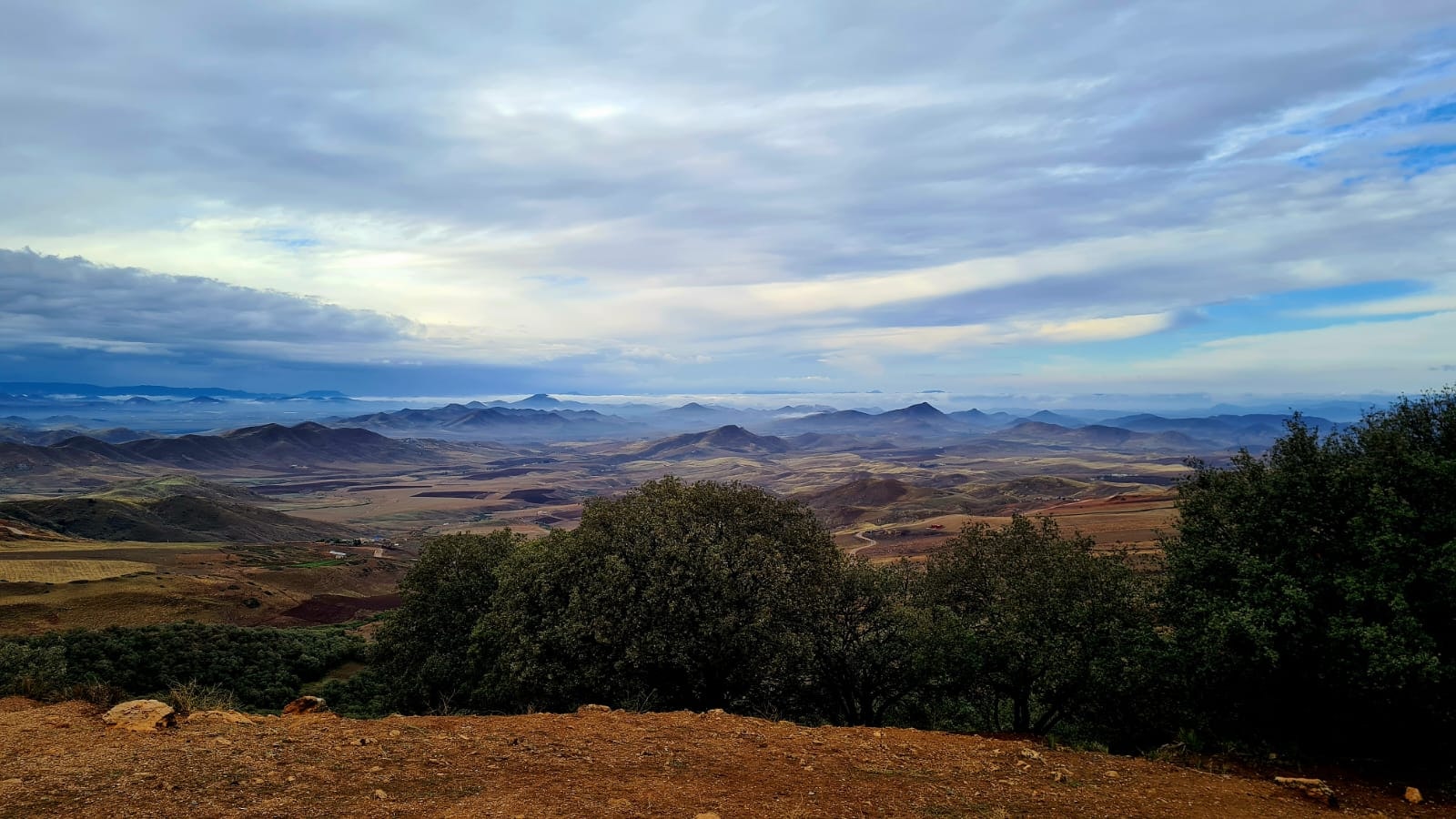 Rolling landscapes of the Middle Atlas with fertile valleys and mist-covered hills