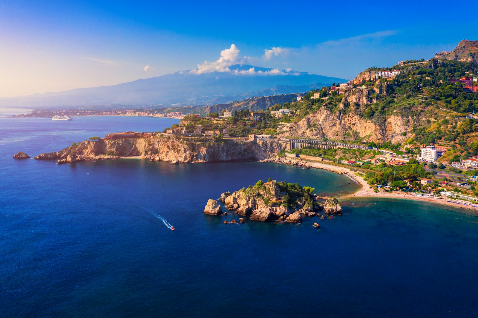 Mount Etna over Taormina cityscape