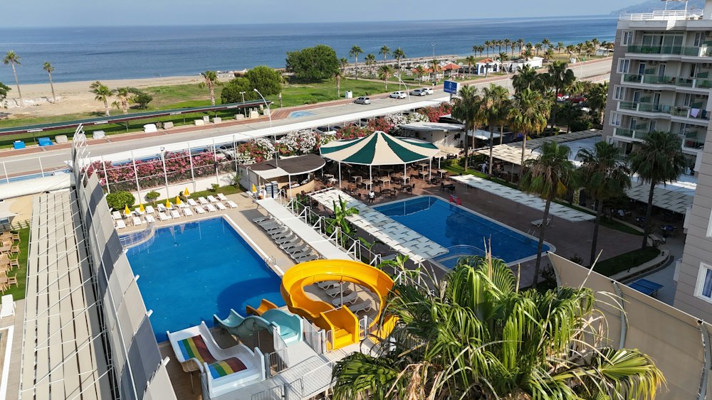Pools and water slides at Grand Akça Resort with the sea beyond, Gazipaşa