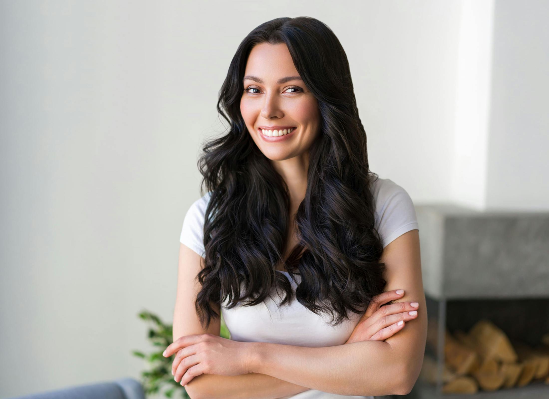 woman smiling and crossing her arms