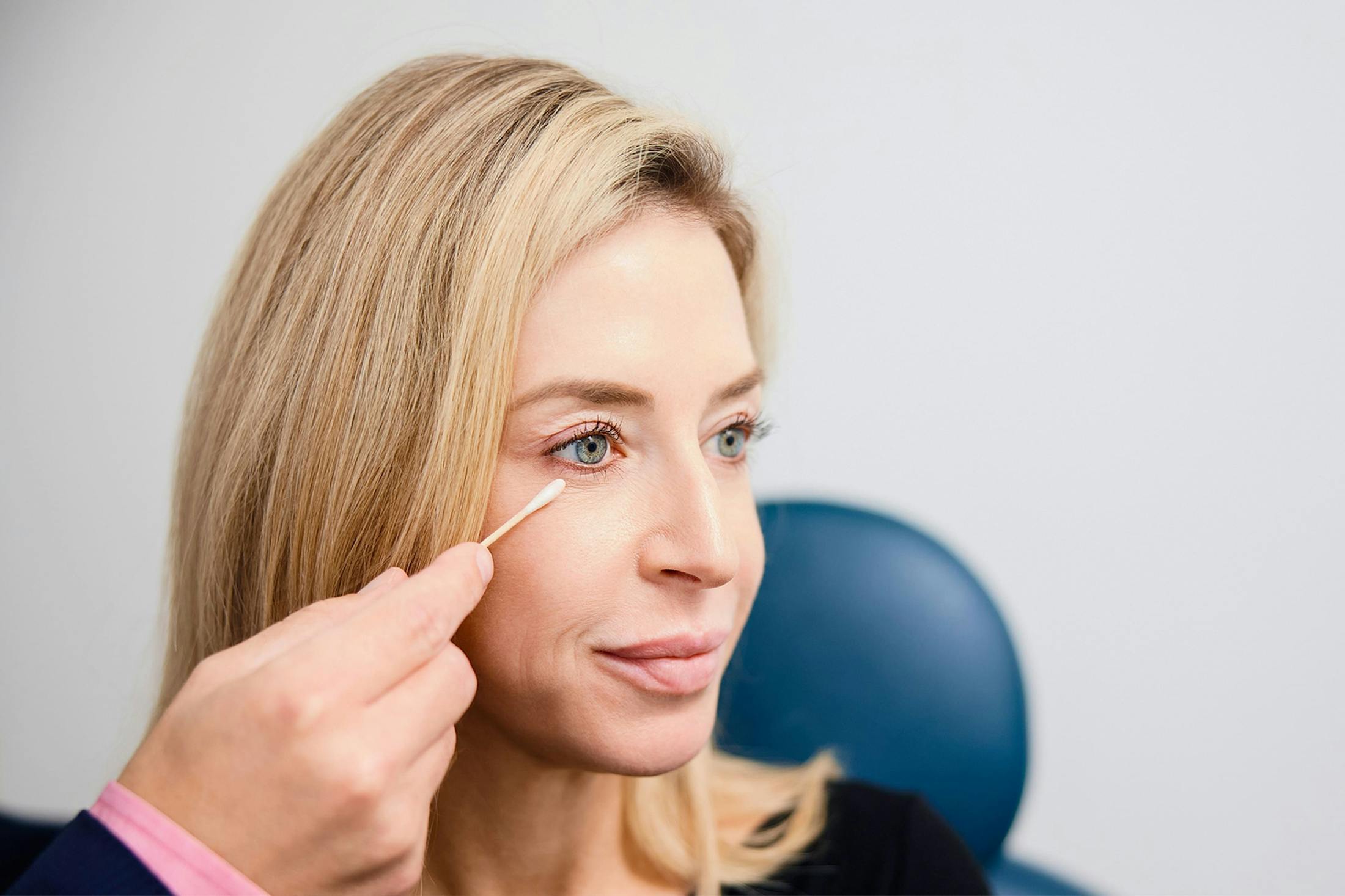 woman getting her under eyes checked