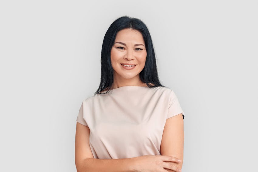 woman with dark hair smiling