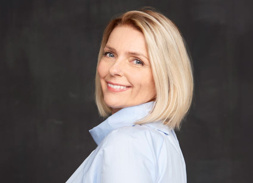 woman smiling over her shoulder