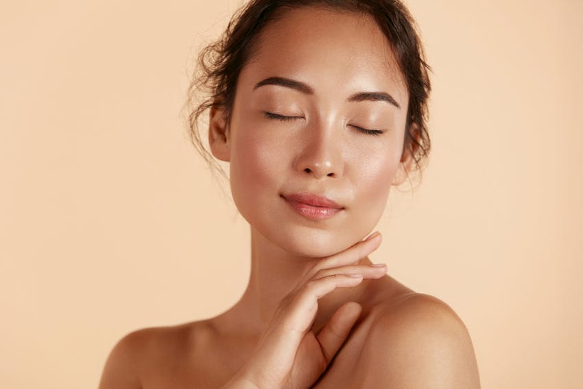 woman touching her chin