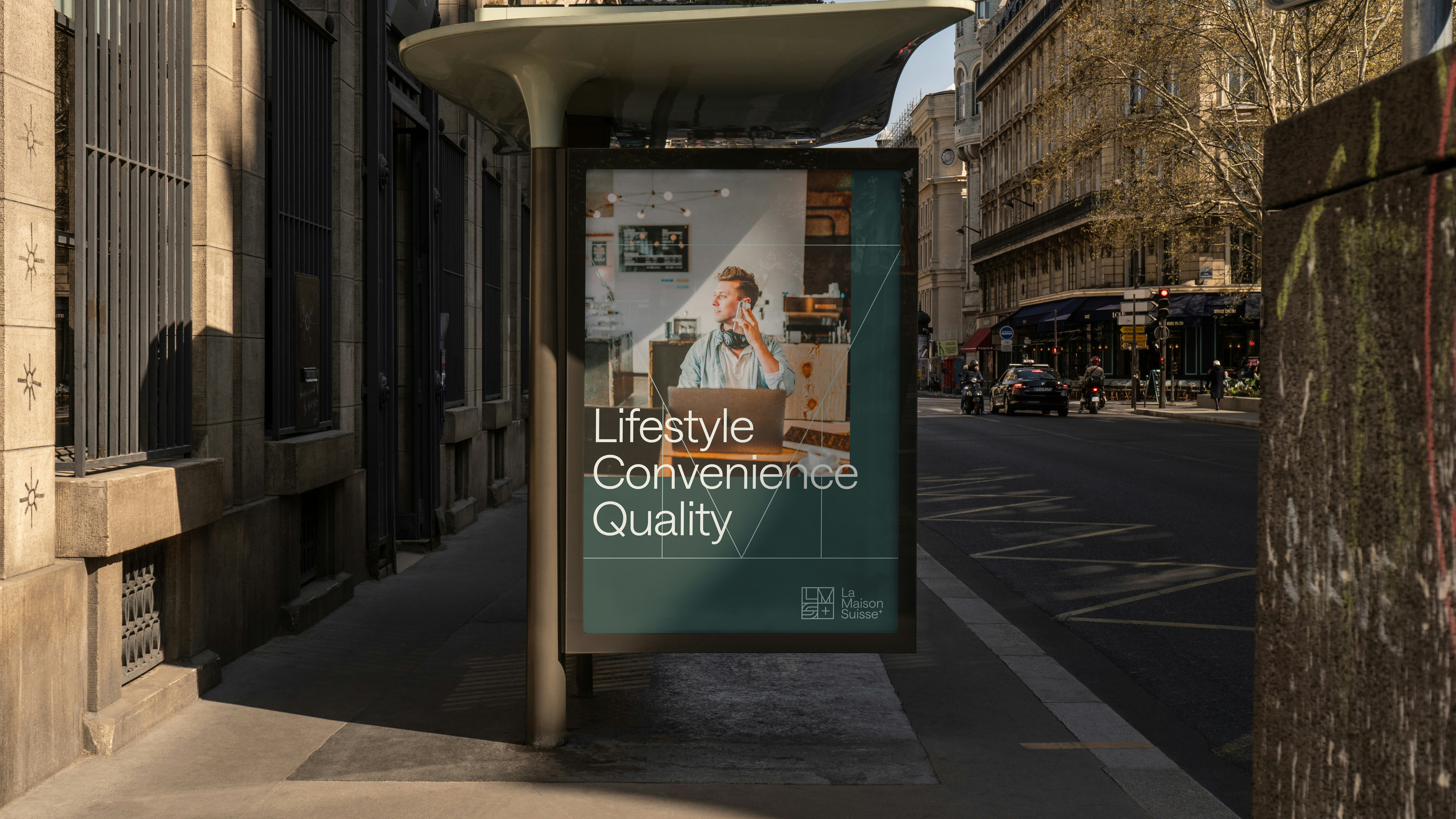 Advertising poster at a bus stop in a city with the text “Lifestyle Convenience Quality” and La Maison Suisse branding.