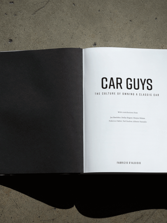 Animated title spread of the Car Guys book featuring a clean black-and-white design.