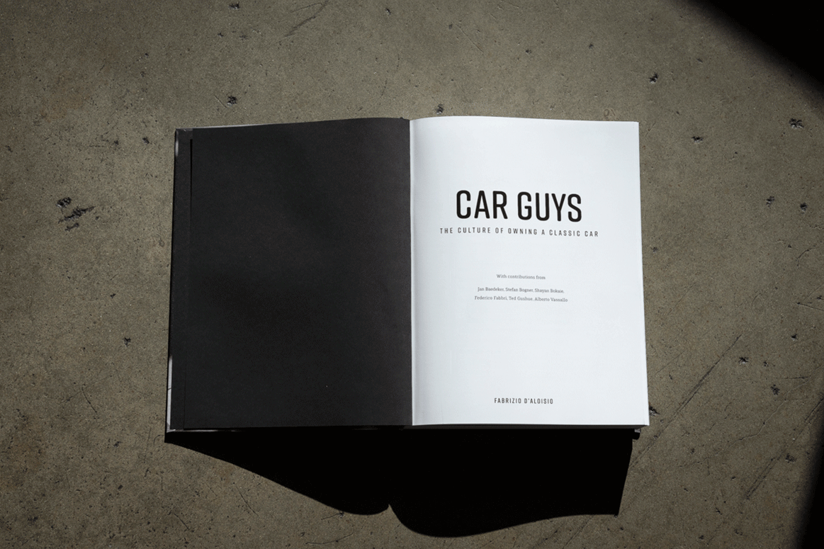 Animated title spread of the Car Guys book featuring a clean black-and-white design.