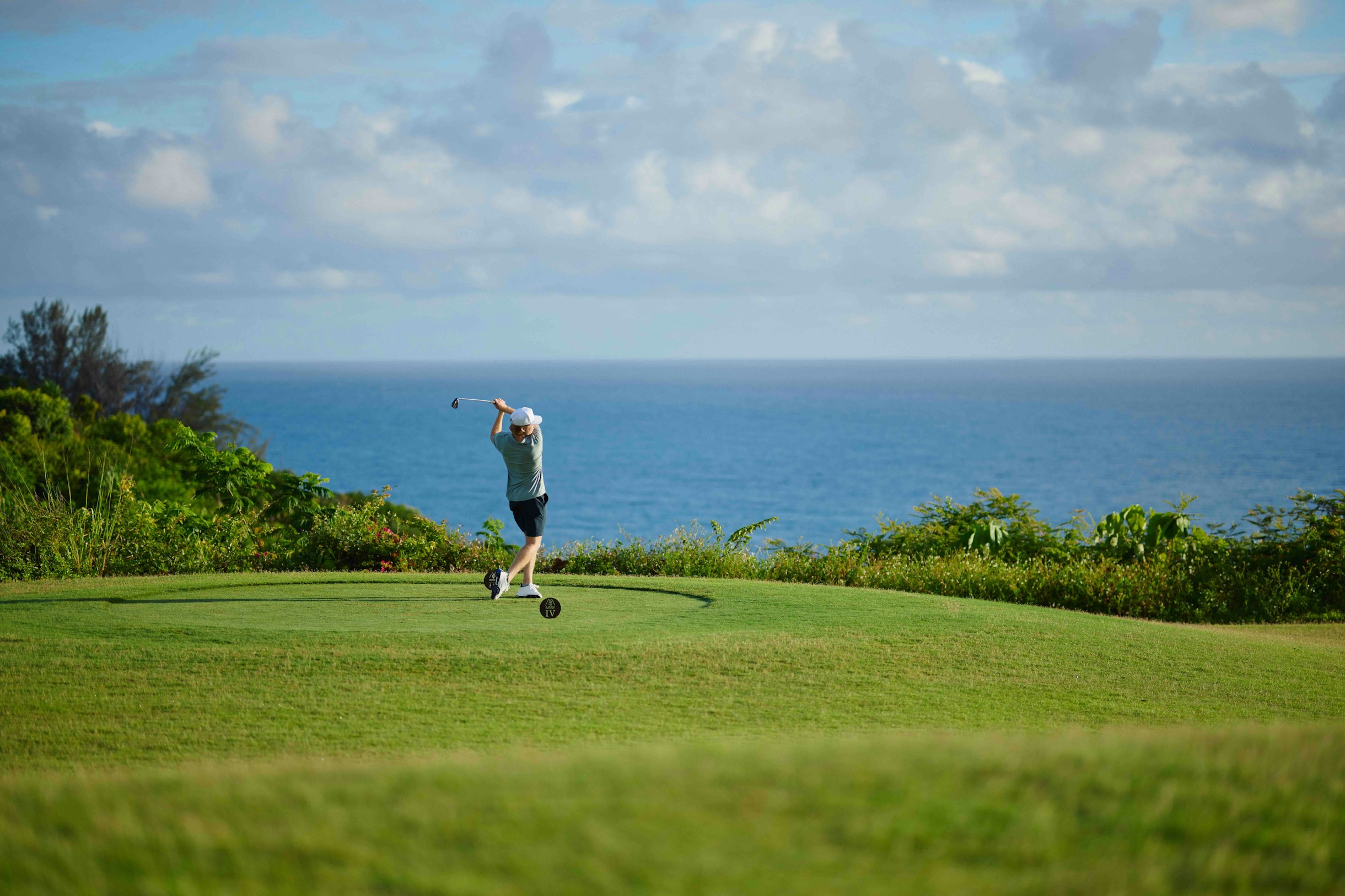 Play an unforgettable round of golf between the ocean and the mountains