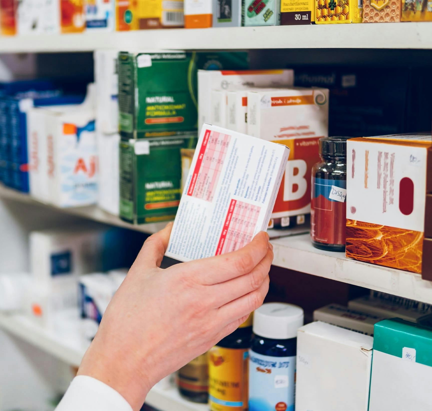 A person picking out meds to take
