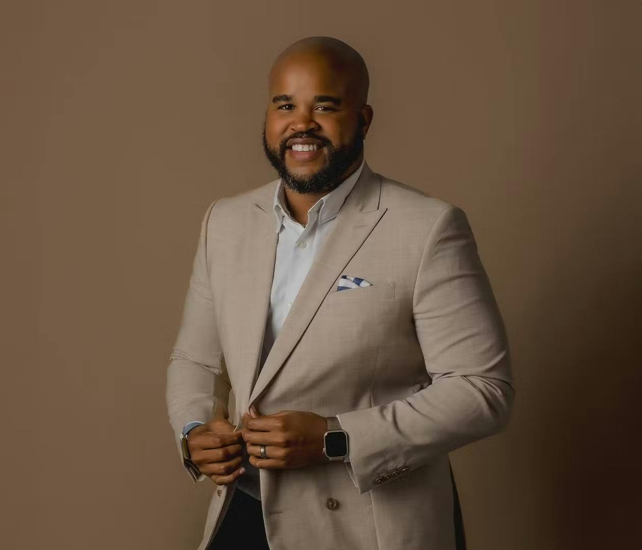 Kyle Jackson in a tan suit