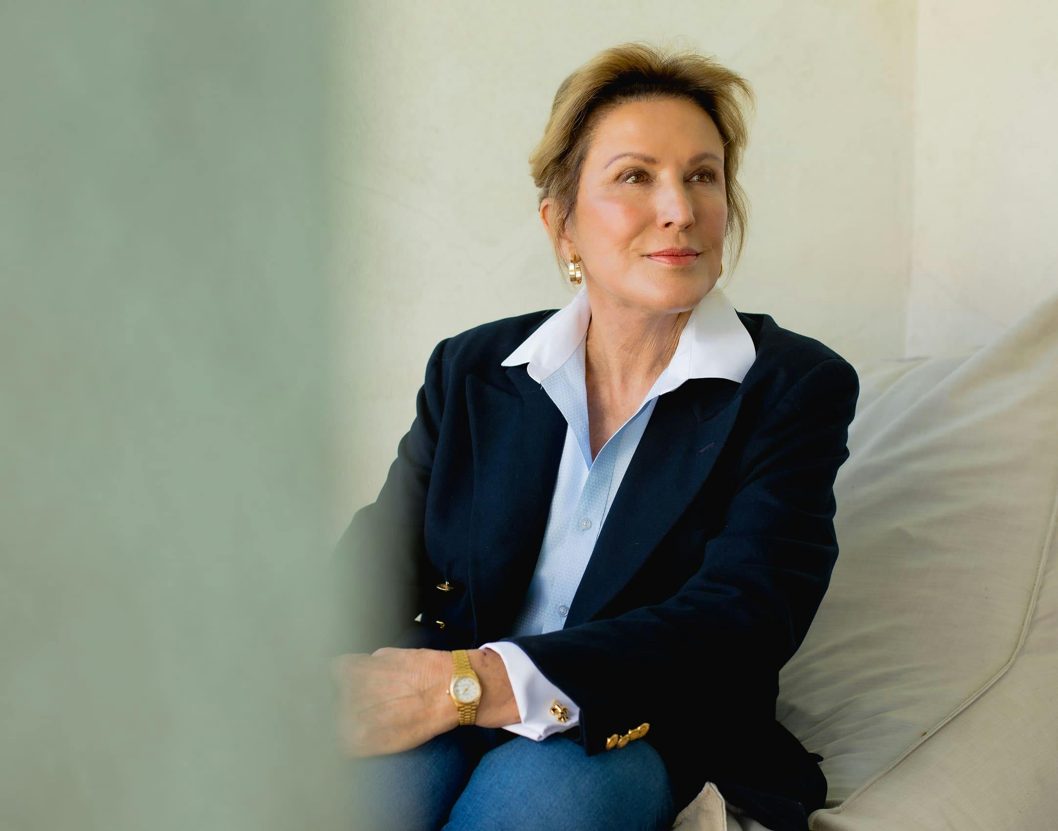 Woman sitting down and smiling